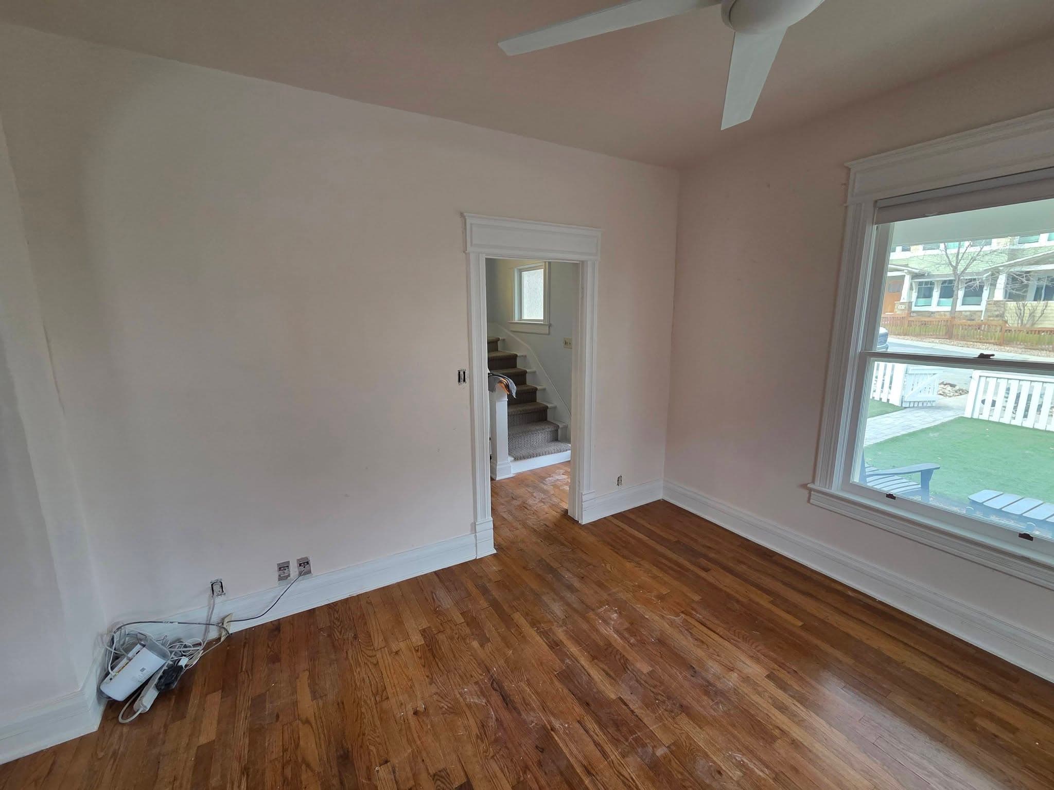 Finished bedroom with hardwood floors